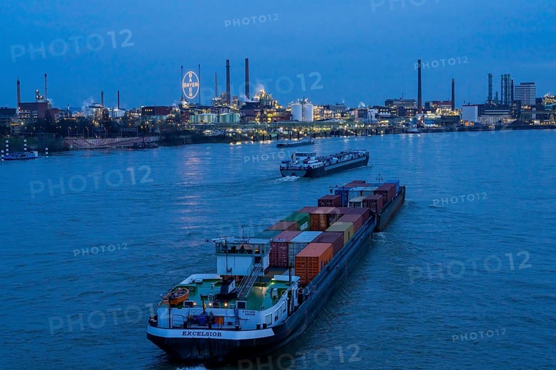 Backdrop of Chempark Leverkusen, Bayer Leverkusen, chemical park, chemical plant, river Rhine, cargo ship, Leverkusen, North Rhine-Westphalia, Germany, Europe