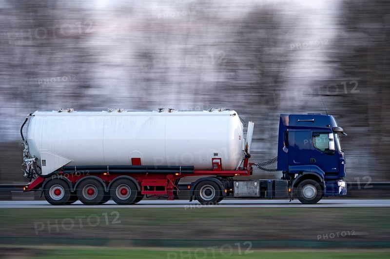 Truck, lorry, articulated lorry with tanker trailer driving fast on the A92 motorway, motion blur, wiping effect, Freising, Upper Bavaria, Bavaria, Germany, Europe