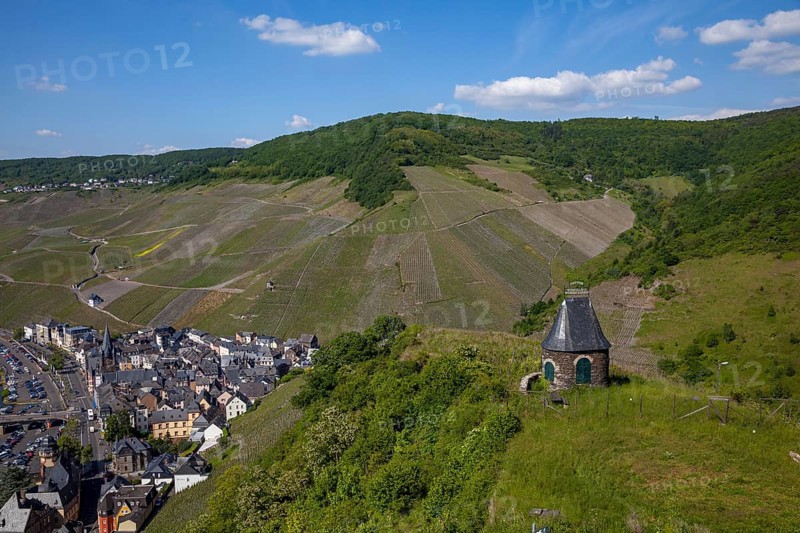 View of a town and a stone hut on a hill surrounded by vineyards and nature, Bernkastel-Kues, Moselle, Rhineland-Palatinate, Germany, Europe