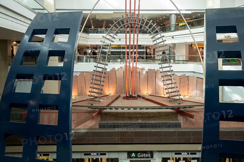 Denver, Colorado, Dual Meridian, sculpture by David Griggs, in Concourse A at Denver International Airport (DEN) . It is just above the rail line which brings passengers to their gates