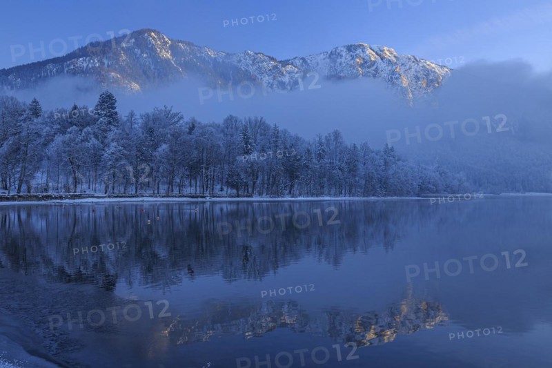 Mountains reflected in lake, winter, snow, evening light, Lake Kochel, foothills of the Alps, Bavaria, Germany, Europe