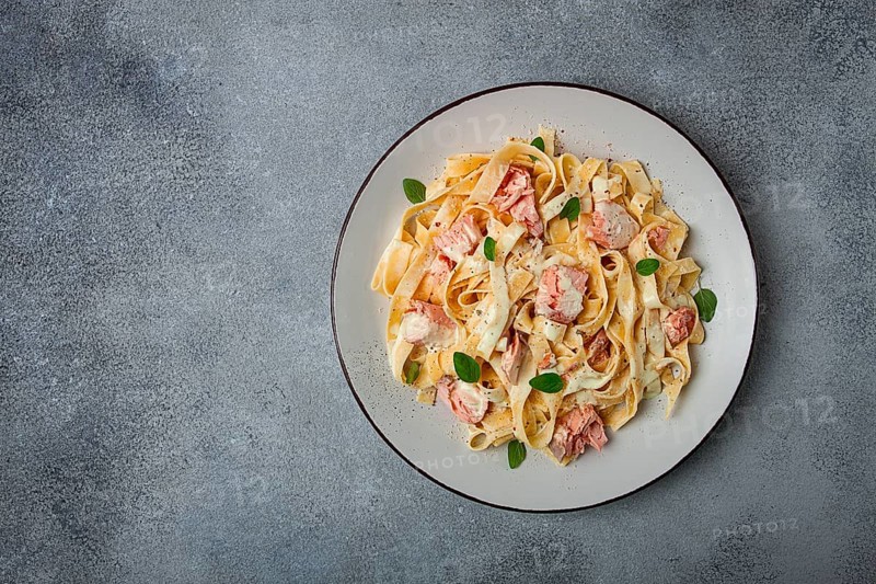 Tagliatelle pasta, in cream sauce with salmon, homemade, no people
