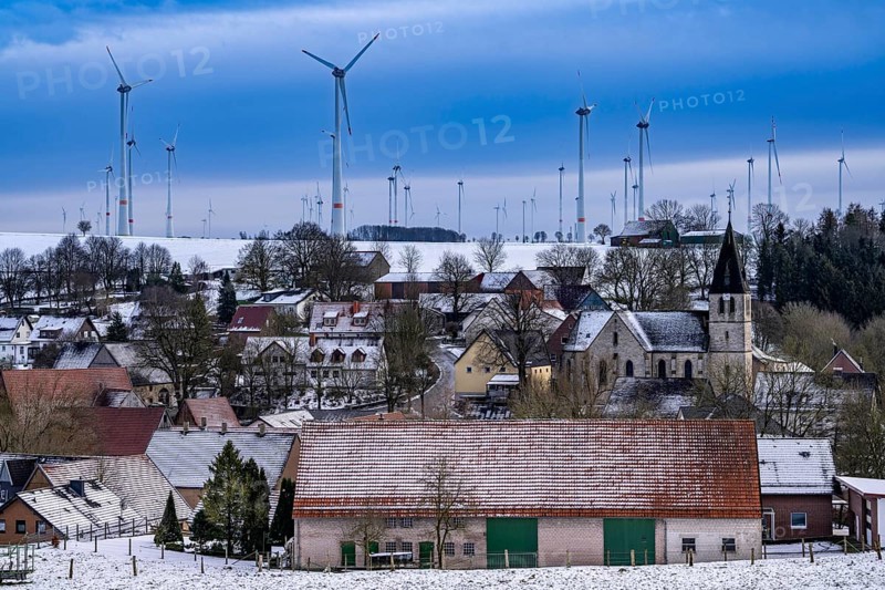 Wind farm, near Iggenhausen, belongs to Lichtenau, self-proclaimed energy town, over 190 wind turbines and over 1200 solar panels generate 10 times as much electricity as the 11, 900-inhabitant community consumes, largest onshore cluster of wind turbines in Germany, winter, slightly snow-covered landscape, North Rhine-Westphalia, Germany, Europe
