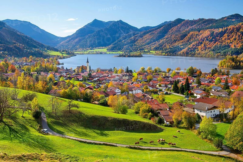 Panorama of the village and lake with the parish church of St. Sixtus and the Brecherspitz 1683m in the Mangfall mountains in autumn, Schliersee, Upper Bavaria, Bavaria, Germany, Europe