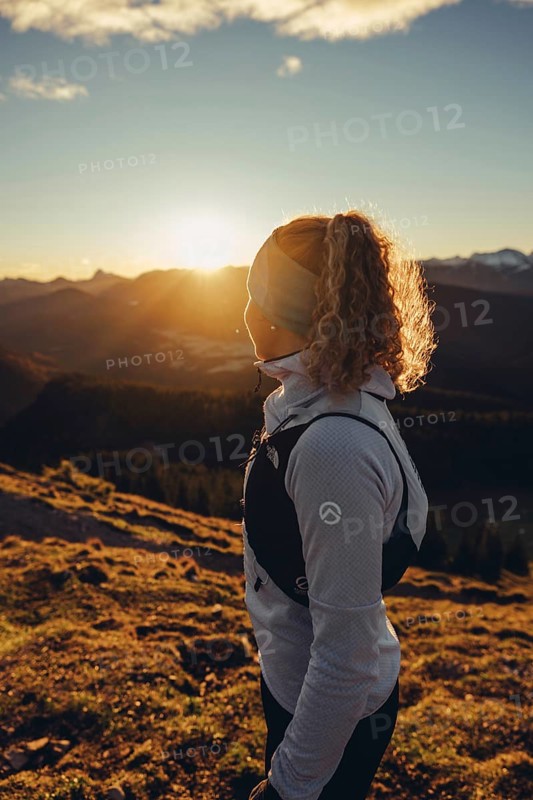 Trail running in autumn on the Jochberg on Lake Walchensee against the wonderful backdrop of the Alps, Bavaria, Germany, Europe