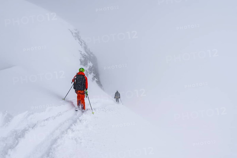 Ski tourers on the Wildhorn, Snowy mountain landscape and fog, Bernese Alps, Bernese Oberland, Switzerland, Europe
