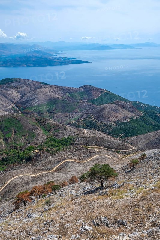 Pantokrator, Corfu, Greece, Mount Pantokrator with a view over the barren mountain landscape and the Ionian Sea towards mainland Albania. At around 917 metres, the Pantokrator is the highest mountain on the island of Corfu. Behind Albania, Europe
