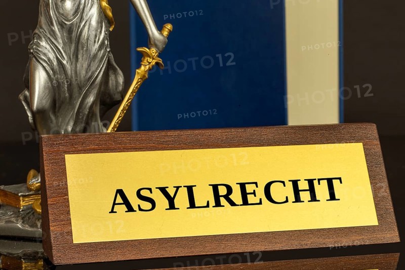 Symbol image of asylum law Germany : Close-up of a brass sign with the inscription ASYLRECHT (asylum law)