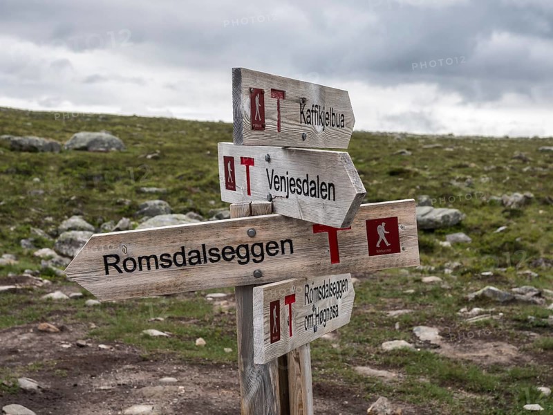 Signpost at trail to mountain ridge Romsdalseggen, famous hiking trip near Andalsnes, Norway, Europe
