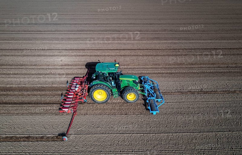 Sugar beet being sown in spring, precision sowing with precision seed drill, behind a tractor, Niederkrüchten, North Rhine-Westphalia, Germany, Europe
