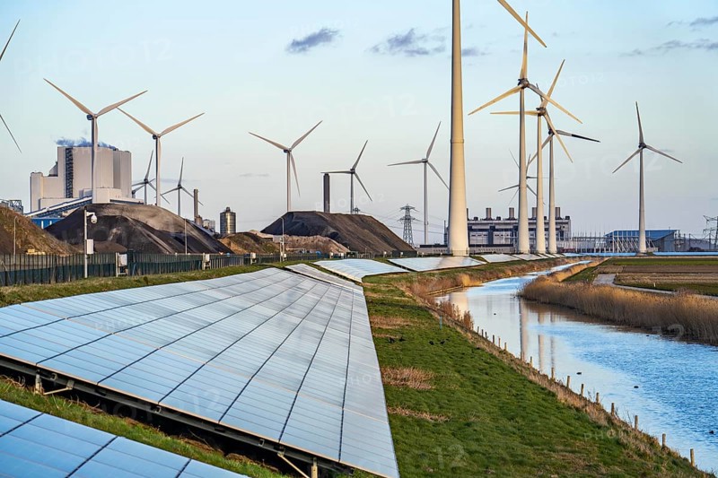 Solar park on the Slaperdijk dyke near the Eemshaven, test project, 17, 000 solar modules were installed over a good 5 kilometres, the Netherlands has over 22, 000 kilometres of dyke line, here it is being tested whether such an installation is successful and can be expanded, wind farm, behind the RWE coal-fired power plant Eemshavencentrale Groningen, Netherlands