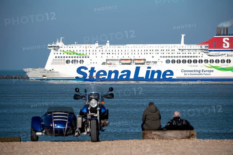 Cargo and passenger ferry of Stena Line, Stena Britannica, sailing between Hook van Holland and Harwich in the UK, harbour entrance of the deep sea port Maasvlakte 2, the seaport of Rotterdam, Netherlands, on a man-made land area off the original coastline