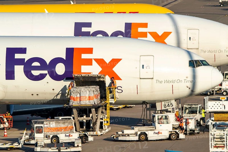 Cologne-Bonn Airport, CGN, FedEx cargo planes standing in front of the air cargo centre, being loaded and unloaded, Eurowings Airbus, North Rhine-Westphalia, Germany, Europe