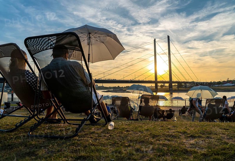 The city beach on the Rhine near Düsseldorf, riverside promenade, by the Rheinkniebrücke bridge, Sunset Chillout, North Rhine-Westphalia