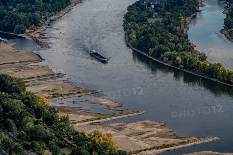 The Rhine at extremely low water, near Bad Honnef, below the Drachenfels, Nonnenwerth Island, dry Rhine banks, cargo ship, descent, with very reduced cargo, North Rhine-Westphalia, Germany, Europe