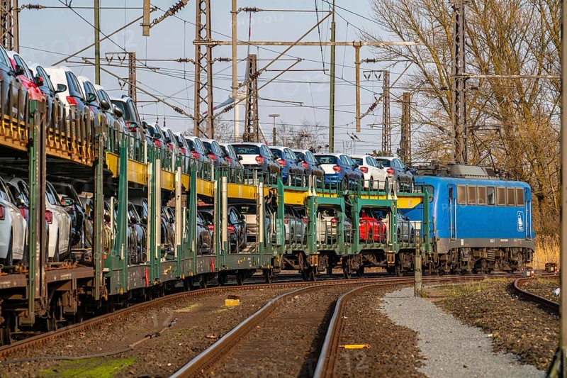 VW plant, Emden, new cars, car transporter, car train, goods train, with VW vehicles, Lower Saxony, Germany, Europe