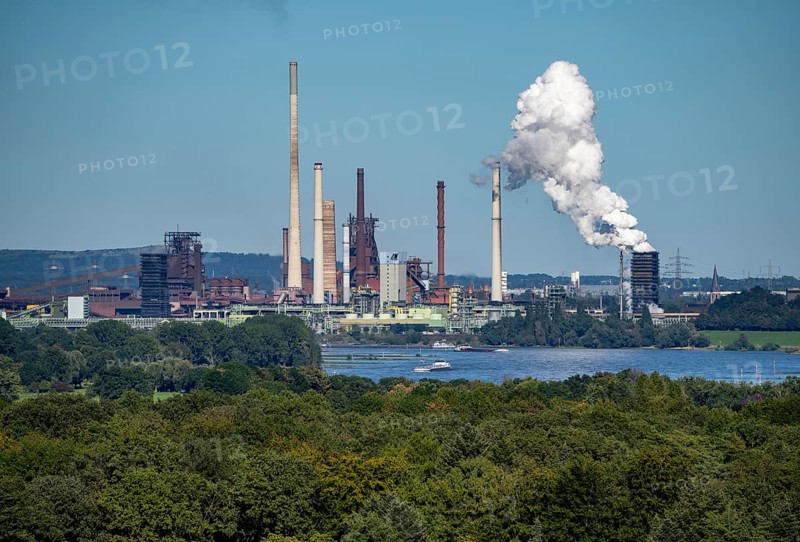 View across the Rhine to the Thyssenkrupp Steel steelworks in Duisburg-Beeckerwerth, blast furnaces, coking plant, green landscape on the left bank of the Rhine, North Rhine-Westphalia, Germany, Europe