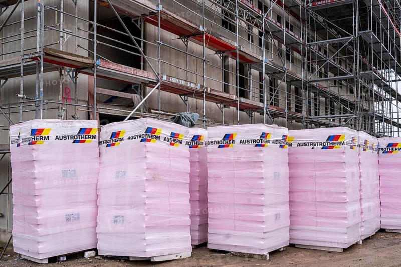 New construction, shell construction, thermal insulation, material waiting to be installed on the façade, energy insulation