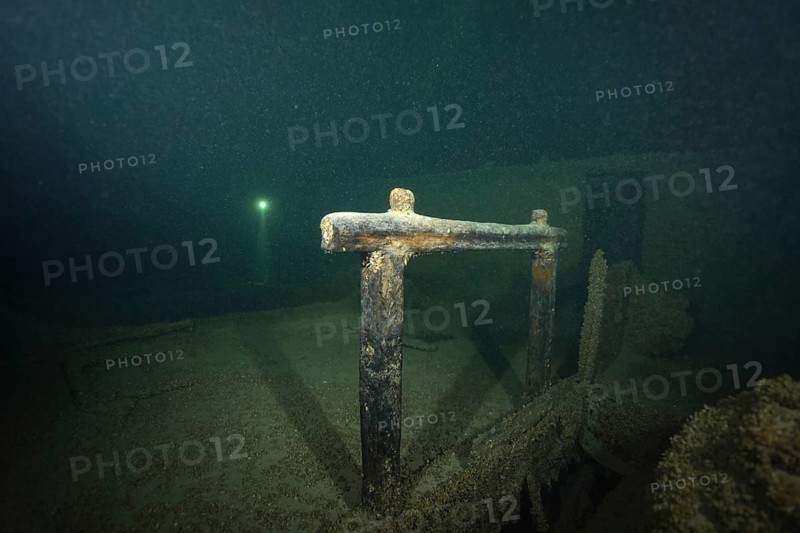 Detailed view of a shipwreck covered with mussels, quagga triangle mussel (Dreissena rostriformis bugensis), invasive species, in the dark, dive site wreck of the Jura, Lake Constance, Bottighofen, Switzerland, Münsterlingen, Germany, Europe