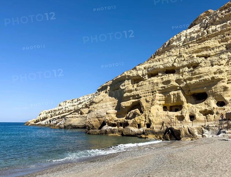 View of sandstone rocks Partial view of former Roman necropolis with sandstone caves carved into sandstone Cave tombs Grottoes in rocks on the north side of Matala Bay, in the 60s and 70s hippie caves Caves for dropouts and hippies today excursion destination on the south coast of the island of Crete, left at the edge of the picture Libyan Sea Mediterranean, Matala, Crete, Greece, Europe