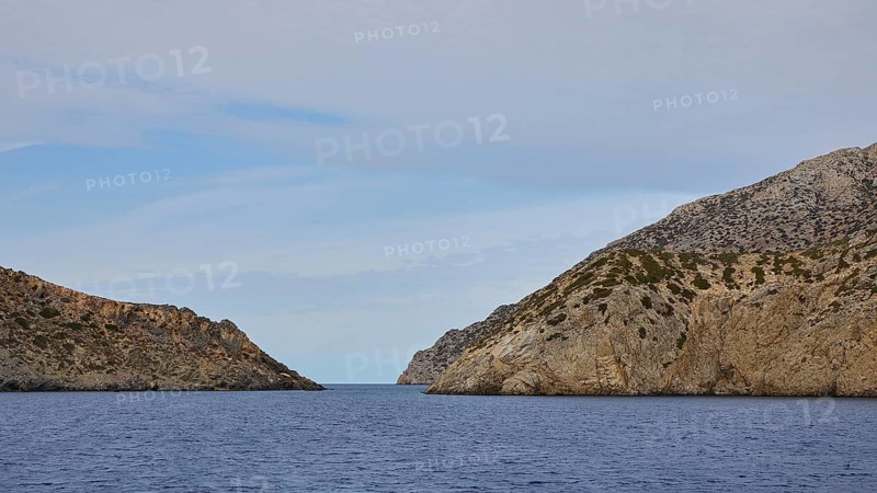 Natural passageway between two steep cliffs overlooking the vast sea, Saria boat tour, Saria Island, Karpathos, Dodecanese, Greek Islands, Greece, Europe