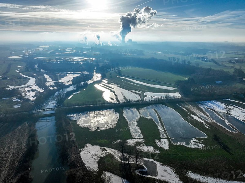 Selm-Waltrop, North Rhine-Westphalia, Germany, After the flood on the Lippe, river in the Ruhr area, the fields, the agricultural land of the farmers next to the watercourse were flooded, serve as retention areas, flood areas for flood protection. The Trianel coal-fired power station in Lünen in the background, Europe