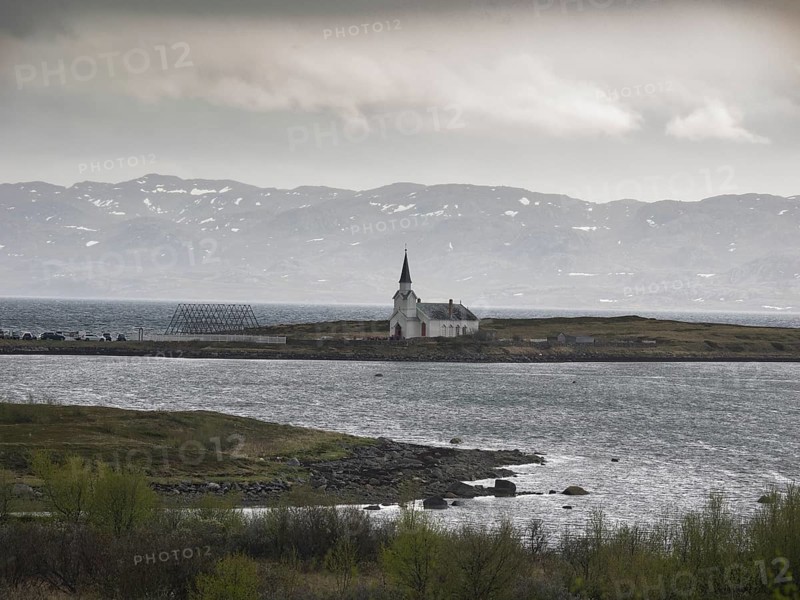 Nesseby town church, with congregation standing outside on Whit Sunday, May, Varanger Fjord, Norway, Europe