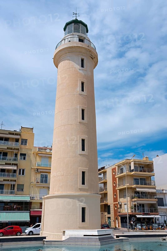 A lighthouse stands out against a clear blue sky, surrounded by buildings, Alexandroupoli, Alexandroupolis, Evros, Eastern Macedonia and Thrace, Greece, Europe