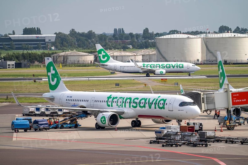 Amsterdam Schiphol Airport, Transavia aircraft taking off on the Aalsmeerbaan runway, aircraft at the terminal, Gates C, check-in, apron, Amsterdam, Netherlands