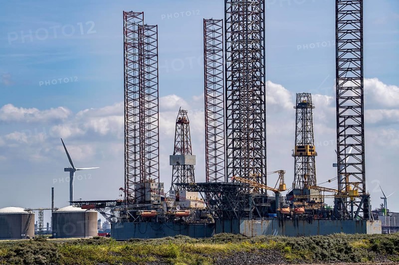 Oil and gas production platforms, drilling rigs being repaired, converted, modernised in the port area of Vlissingen-Oost, Netherlands