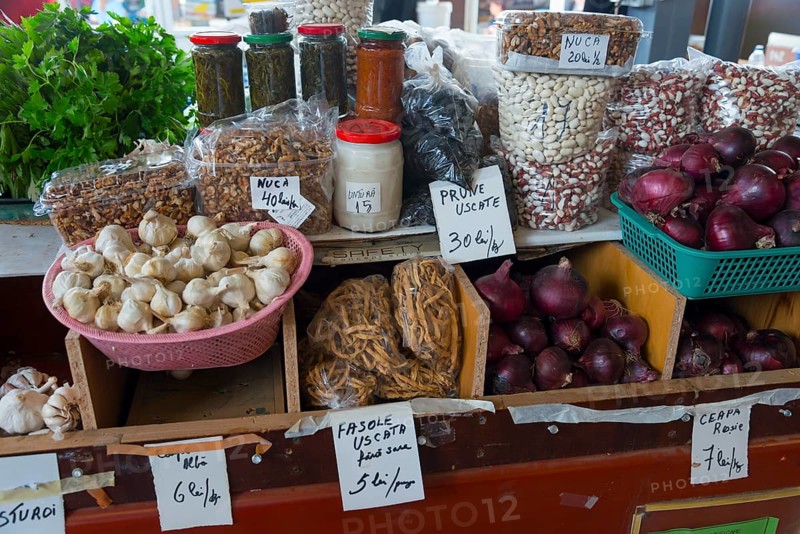 Various dried fruits, onions and nuts in jars on a market stall with price tags, market hall, Fagaras, Fagara?, Fogarasch, Fugreschmarkt, Brasov, Transylvania, Romania, Europe