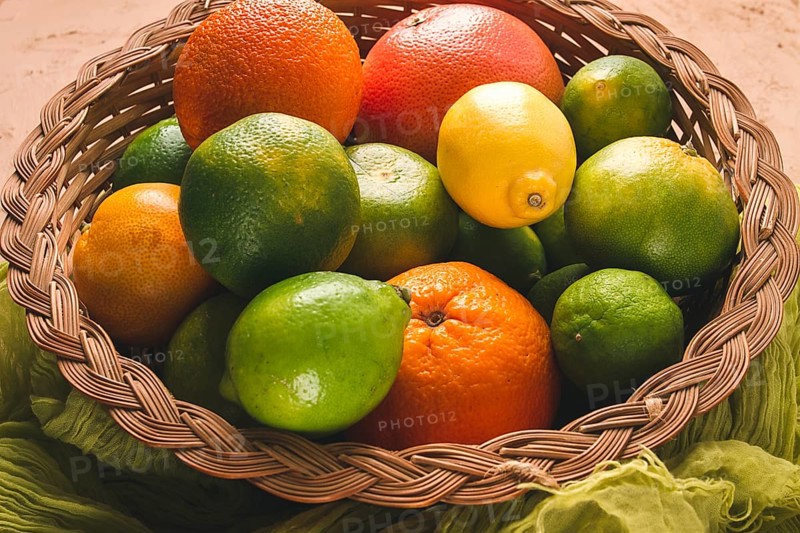 Assortment, citrus fruits, in a basket, close-up, top view, no people