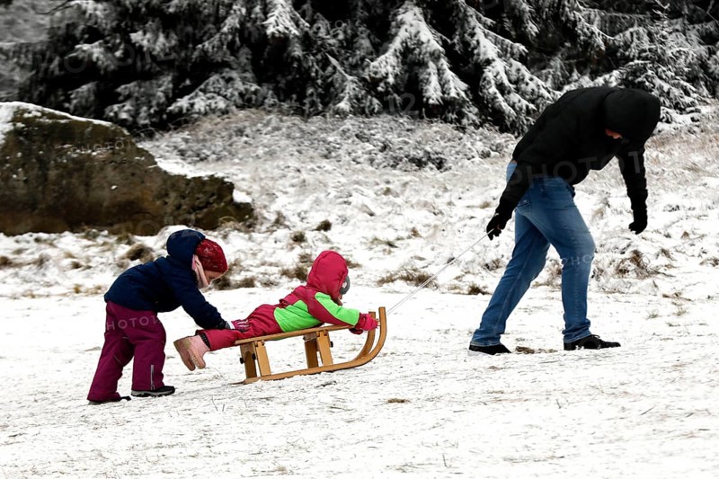 The first snow is here. Despite the coronavirus pandemic, families with children are enjoying wintry conditions on the toboggan run in Torfhaus in the Harz Mountains, 27 December 2020