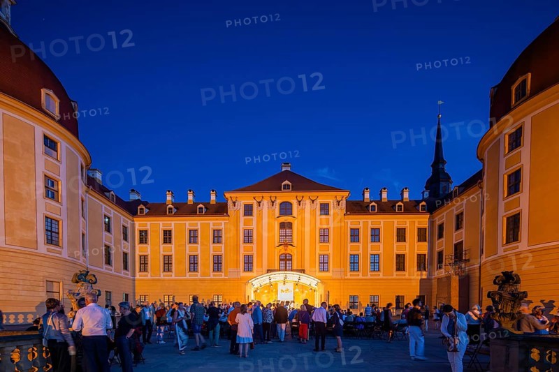 The Moritzburg Festival is an annual chamber music event in Saxony. It was founded in 1993 in Moritzburg by the soloists Kai Vogler, Peter Bruns and Jan Vogler. In Moritzburg, the artists find the ideal setting for the realisation of their musical dreams. The Moritzburg Festival, which has been under the sole artistic direction of cellist Jan Vogler since 2001, has long since established itself internationally as one of the most important festivals for chamber music thanks to its exceptional quality. Here is an evening concert on the north terrace of the baroque palace, Moritzburg Chamber Music Festival, Moritzburg, Saxony, Germany, Europe