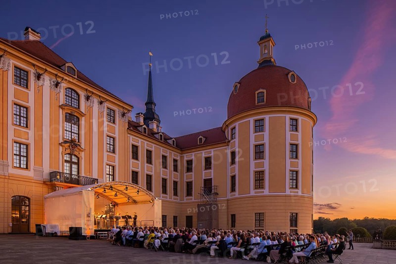 The Moritzburg Festival is an annual chamber music event in Saxony. It was founded in 1993 in Moritzburg by the soloists Kai Vogler, Peter Bruns and Jan Vogler. In Moritzburg, the artists find the ideal setting for the realisation of their musical dreams. The Moritzburg Festival, which has been under the sole artistic direction of cellist Jan Vogler since 2001, has long since established itself internationally as one of the most important festivals for chamber music thanks to its exceptional quality. Here is an evening concert on the north terrace of the baroque palace, Moritzburg Chamber Music Festival, Moritzburg, Saxony, Germany, Europe