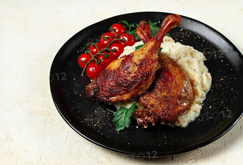 Fried duck shank, cauliflower puree, cherry tomatoes, homemade, no people