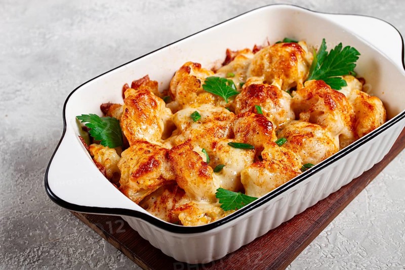 Baked cauliflower, in cream sauce, with cheese and spices, homemade, no people