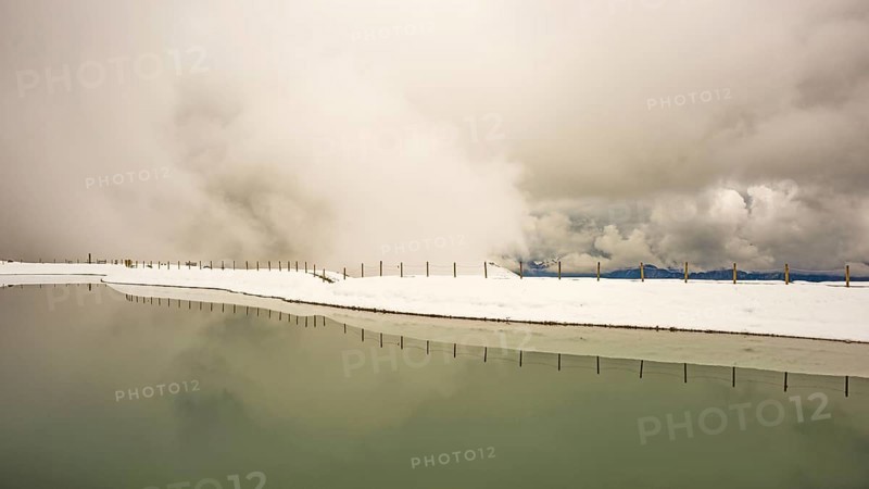 Onset of winter in May, Riezler Alpsee, an artificial lake, snow pond, feeds the snow cannons that provide the slopes of the Fellhorn and Kanzelwand cable cars with snow, Allgäu Alps, Vorarlberg, Austria, Europe