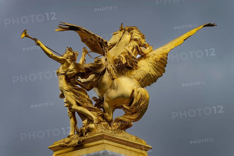 Column with the group of figures Fama of War on the Pont Alexandre III bridge over the Seine, Paris, France, Europe