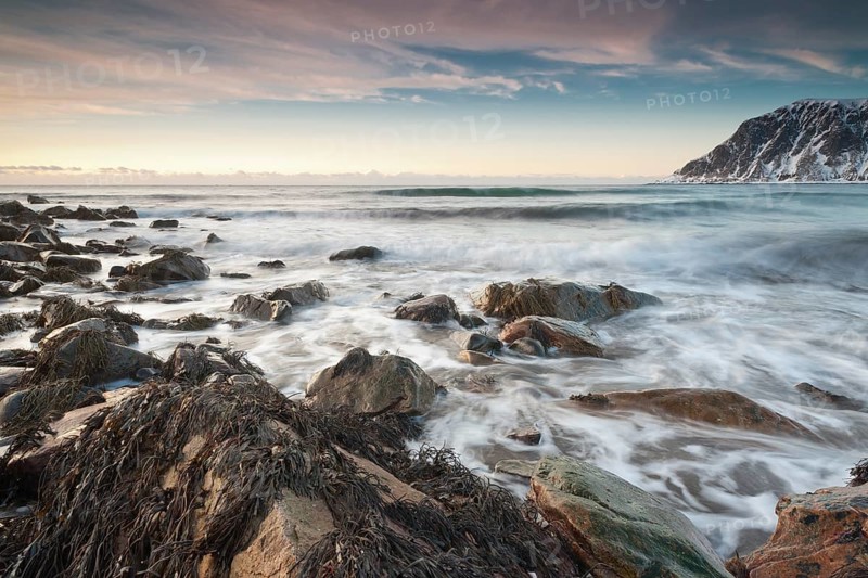 Long exposure, winter evening mood at Skagsanden, stones on the beach at Flakstad, Flakstadøy, Lofoten, Nordland, Norway, Europe