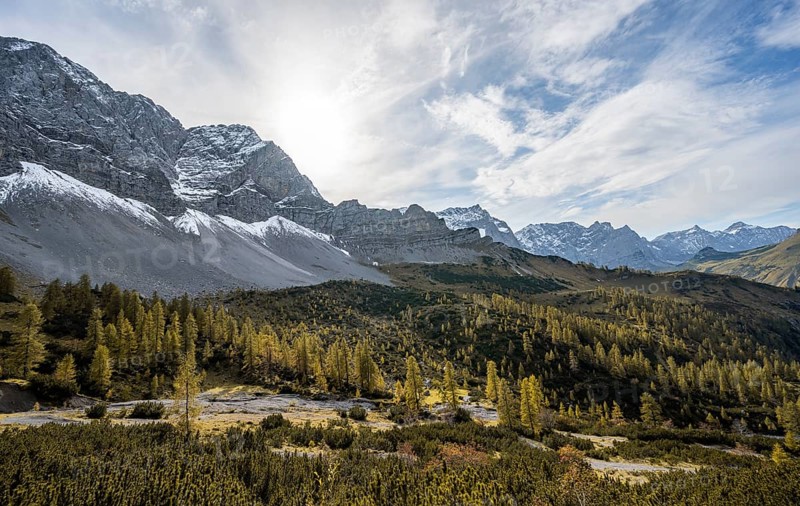 Mountain panorama with steep rocky peaks, yellow-coloured larches in autumn, hike to the summit of the Hahnkampl, Engtal, Karwendel, Tyrol, Austria, Europe