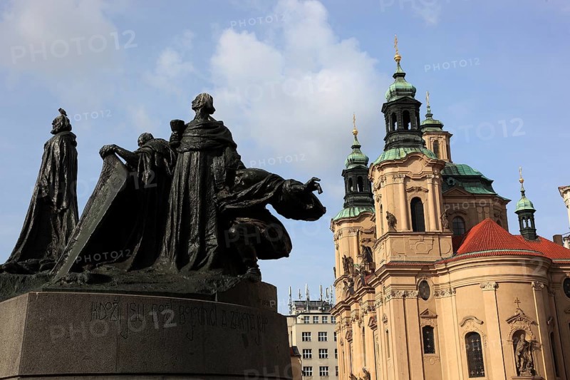 Jan Hus Monument on Old Town Square and the baroque St Nicholas Church, Prague, Czech Republic, Europe