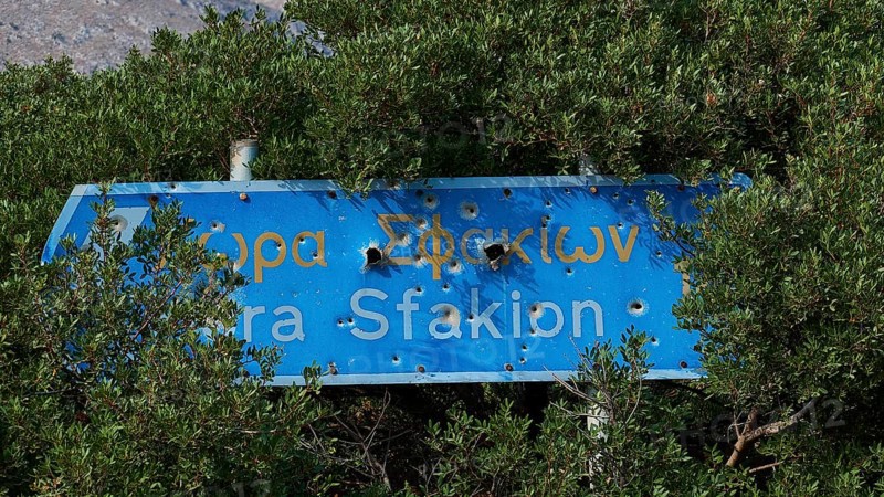 Signpost, Chora Sfakion, bullet holes, Frangokastello, Venetian fortress, castle, Sfakia, West Crete, south coast, island of Crete, Greece, Europe