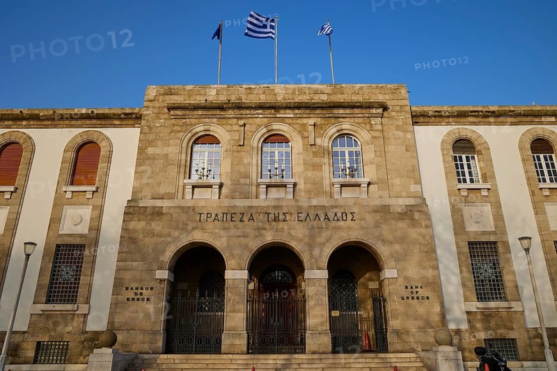 Greek Bank Building, Historic building with stone masonry and columns, decorated with Greek flags against a blue sky, Rhodes Old Town, Rhodes Town, Rhodes, Dodecanese, Greek Islands, Greece, Europe