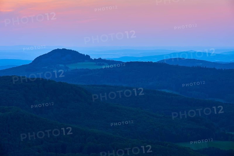 A calming mountain landscape at dusk with soft blue tones and a romantic horizon, Milseburg, Abtsroder Kuppe, Abtsroda, Rhön, Hesse, Germany, Europe