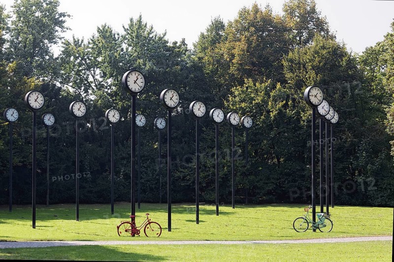 Station clocks with synchronised time, art installation Zeitfeld by Klaus Rinke in the Volksgarten Düsseldorf, North Rhine-Westphalia, Germany, Europe