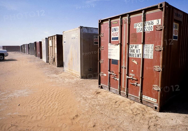 Shipping container with equipment in a storage facility for oil drilling, Dhahran, Arabian Desert, Saudi Arabia 19789