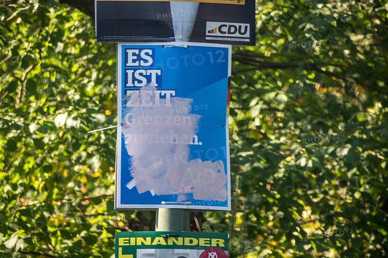 State election in Brandenburg 2024: parties canvass for votes on election posters. Graffitied poster of the AfD party. Potsdam, Brandenburg, Germany, Europe