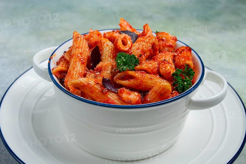 Penne pasta, with shrimp in tomato sauce, close-up, no people