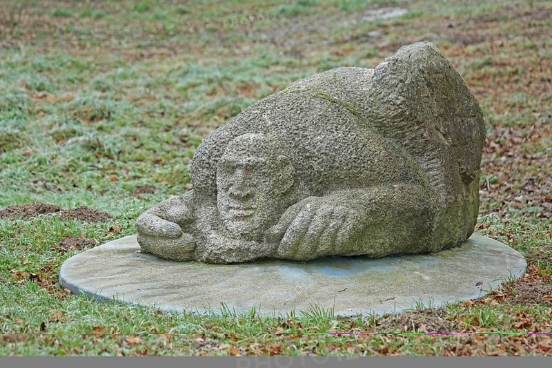 Sculpture Finding by Laura Danzi 2018, stone sculpture, thick, rough, surface, lying, head, face, hands, hand, detail, sculpture park, Wettersbach, Palmbach, Grünwettersbach, Karlsruhe, Baden-Württemberg, Germany, Europe